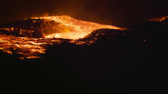 Camera tilts to reveal river of lava