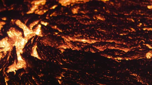 Close up of lava flowing during the night 2