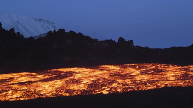 Camera pans to show river of lava 2