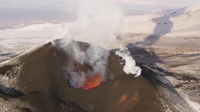 Aerial shot of volcano erupting in Kamchatka Russia