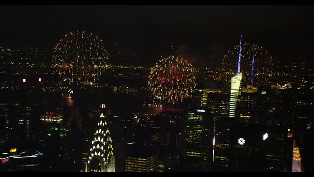 Wide Shot Sweeping Fireworks, to Empire, Bank America and Conde Nast