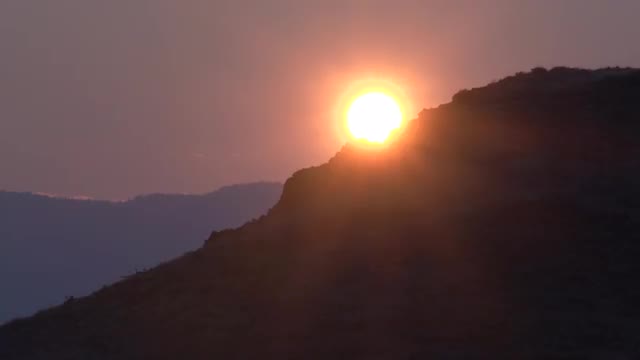 Sun Setting Over Mountain Ridge - British Columbia