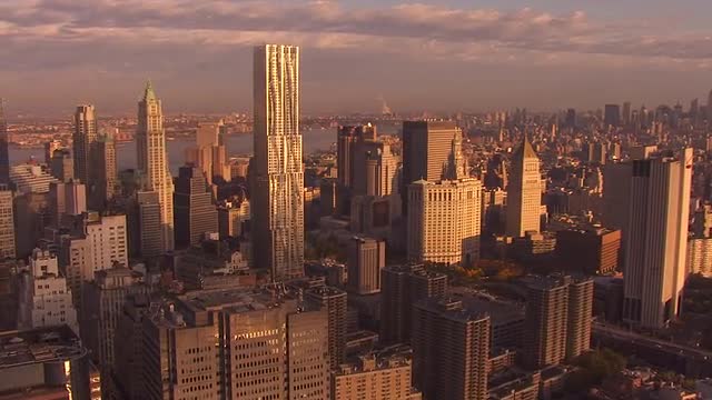Wide Shot Push in Downtown manhattan, Beekman Tower, Sunset reflect on buildings