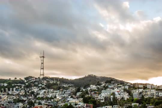 Rolling clouds over hillside