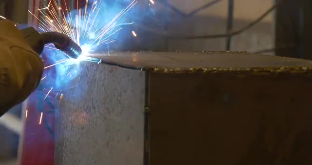 Welding metal welding machine. Spatter, work gloves melt metal iron construction