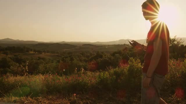 Young man listening to music in nature