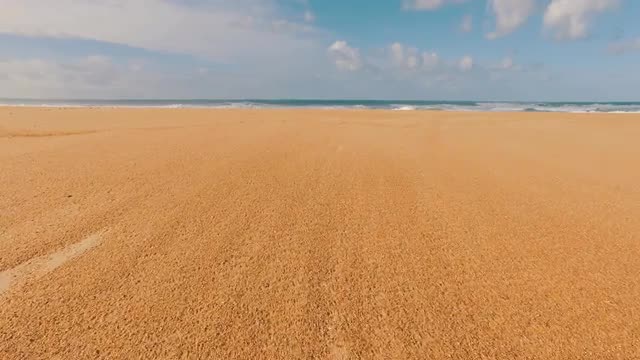 Ocean Waves Incoming on Sand Beach, POV walking