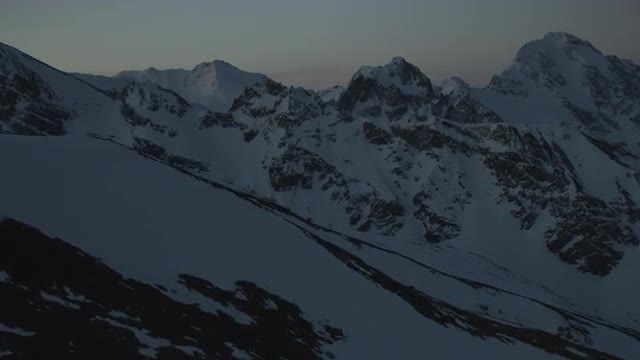 Aerial shot of snowy mountain range