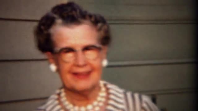 1961: Traditional conservative grandma wearing formal pearl necklace.  