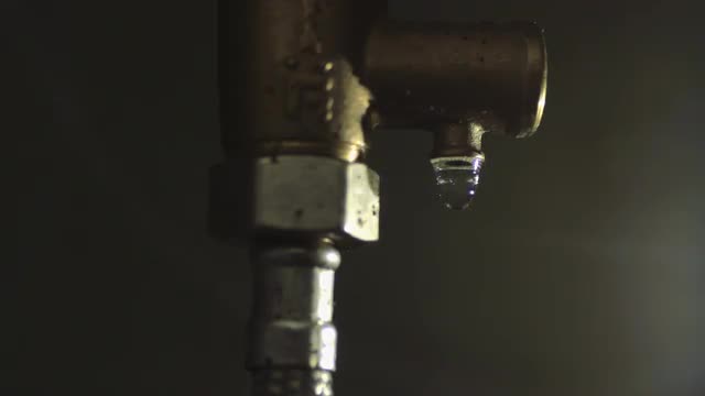 Drop Drips From a Pipe Tube
