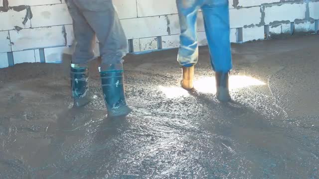 Concreting the Floor With Showels