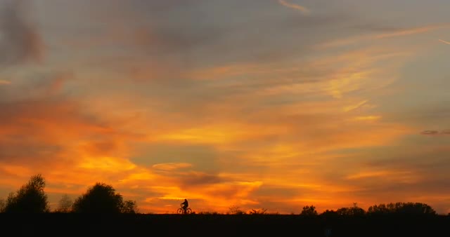 Man by Bicycle Man's Silhouette at Opposite Bank Man by Bicycle Close up Bright Yellow Sunset at
