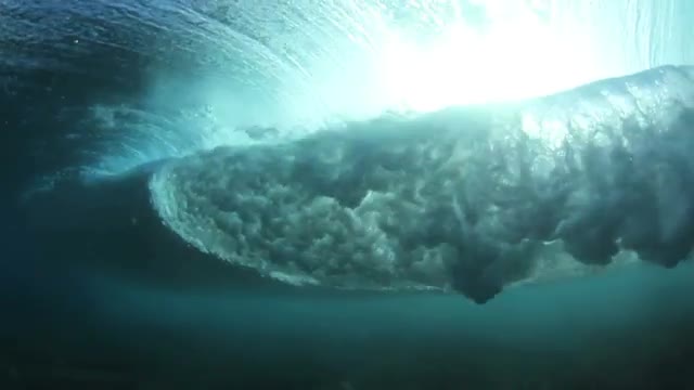 Slow Motion Underwater Ocean Wave With Sun