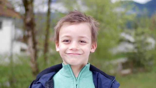 Simpathic kid smiling in camera