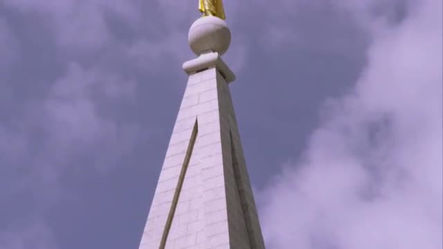 Tight tilting up shot of the spires of the LDS Salt Lake Temple.