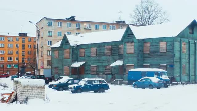 Wooden Barrack House Near Block of Flats in Russian Town