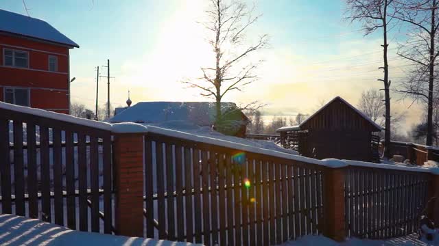 Fence Near Wooden Rural House in Winter