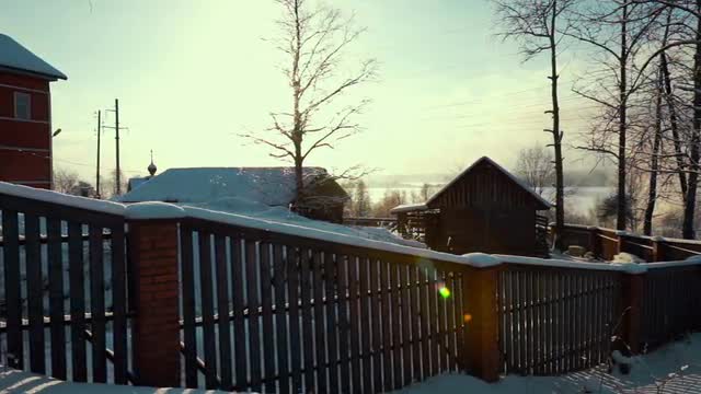 Fence Near Wooden Rural House in Winter