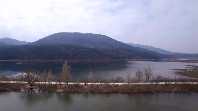 Flying over lake in early spring