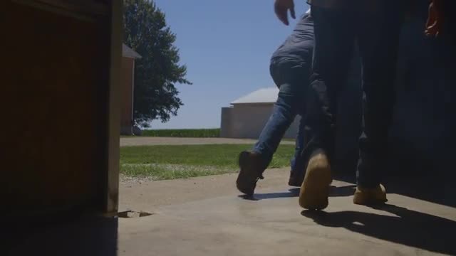 Caucasian father and son opening barn door