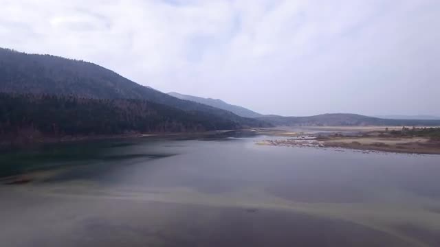 Flying over lake in early spring
