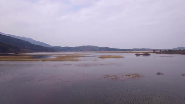 Flying over lake in early spring