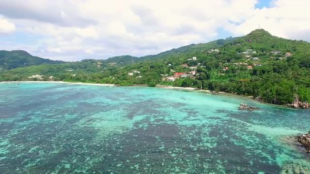 Aerial panorama of Anse Royale beach on Mahe Island, Seychelles.