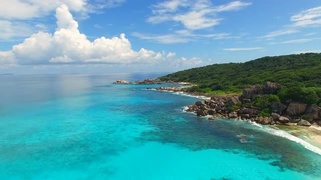 Aerial view (landscape) of tropical paradise beach (coast) with white sand and azure sea water
