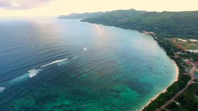 Aerial panorama of Anse Royale tropical coast on Mahe Island, Seychelles, twilight time.