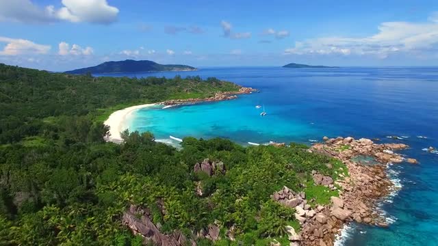 Aerial view of tropical paradise coast with white sand and turquoise sea water of Indian Ocean