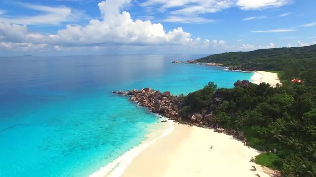Aerial view of tropical paradise beach with white sand and turquoise water