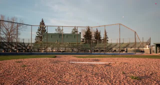 Motion time-lapse of pitchers mound at baseball diamond