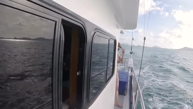 a Woman Comes Out of the Cabin of the Boat For Sea Fishing on Board