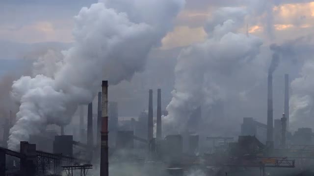 Air Pollution From Industrial Plants. Large Plant on the Background of the City. Pipes Throwing Smok