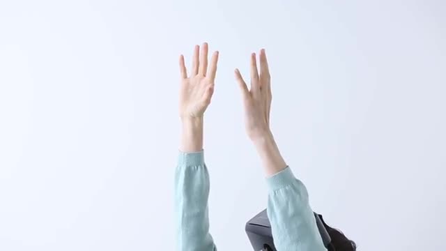 Japanese young woman using virtual reality device