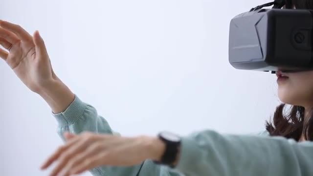Japanese young woman using virtual reality device
