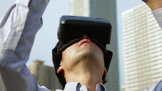 Japanese man using virtual reality device