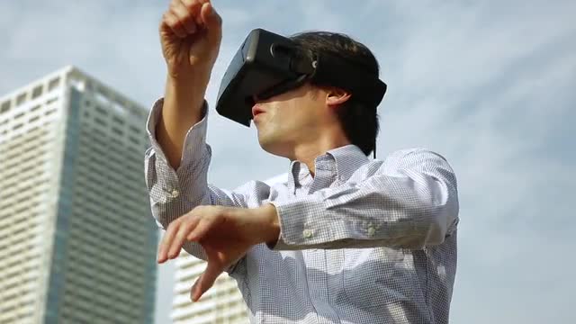 Japanese man using virtual reality device