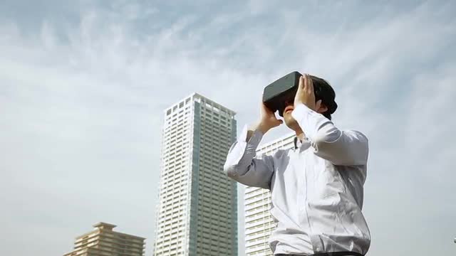 Japanese man using virtual reality device