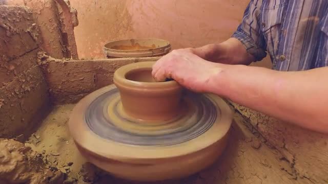Creating a pot on a potter's wheel. 4K