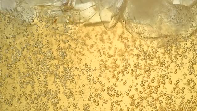 Ginger ale in a glass with ice