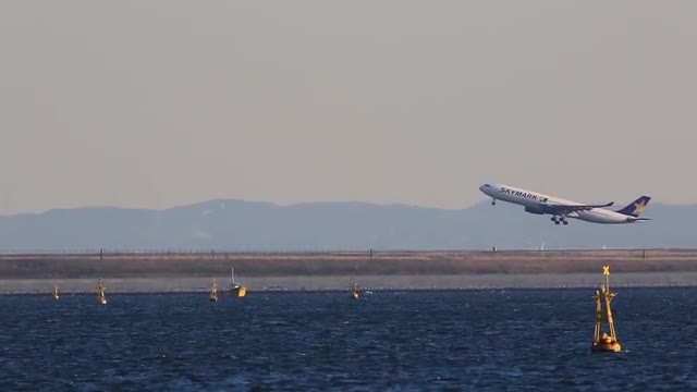 Airplane taking off from Haneda airport in Tokyo, Japan