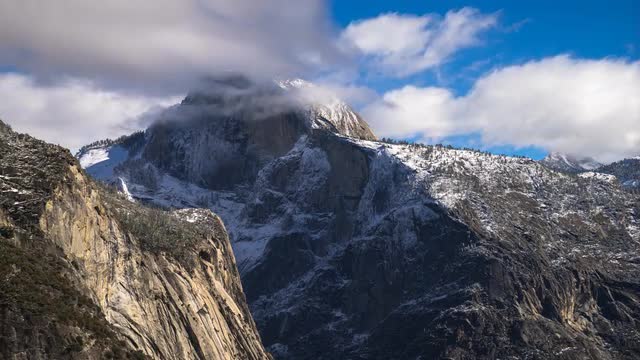 Snow covered Half Dome timelapse