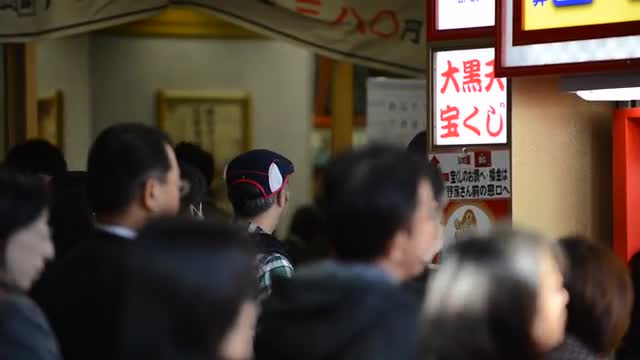 People in a line to buy lottery tickets in Yurakucho,  Tokyo