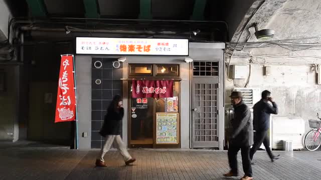 People walking in a passageway below Yurakucho Station,  Tokyo