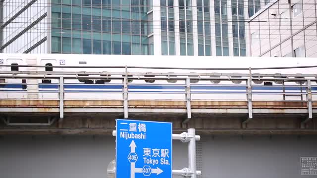 Bullet train passing on elevated railtrack, Tokyo