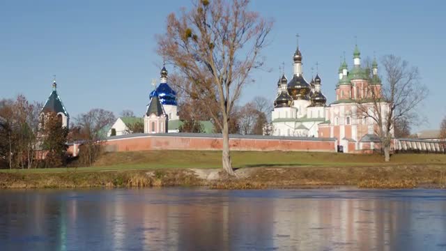 Exterior of Gustynya Holy Trinity Monastery Female Monastery View From the Side of a Lake Brick Wall