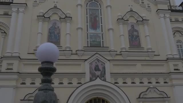 Main Entrance of Transfiguration Cathedral Golden Cupolas Are Shining Images on a Wall Above the Doo