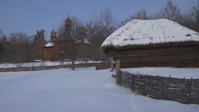 Wooden Church Behind a Rustic Huts Winter Snow Wattle Fence Church of the Holy Michael the Archangel
