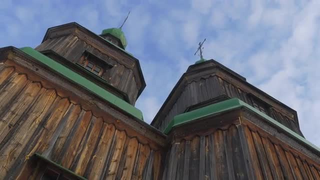 Wooden Church Green Roofs on a Bell Towers Windows Blue Sky Church of Paraskeva the Holy Martyr in P